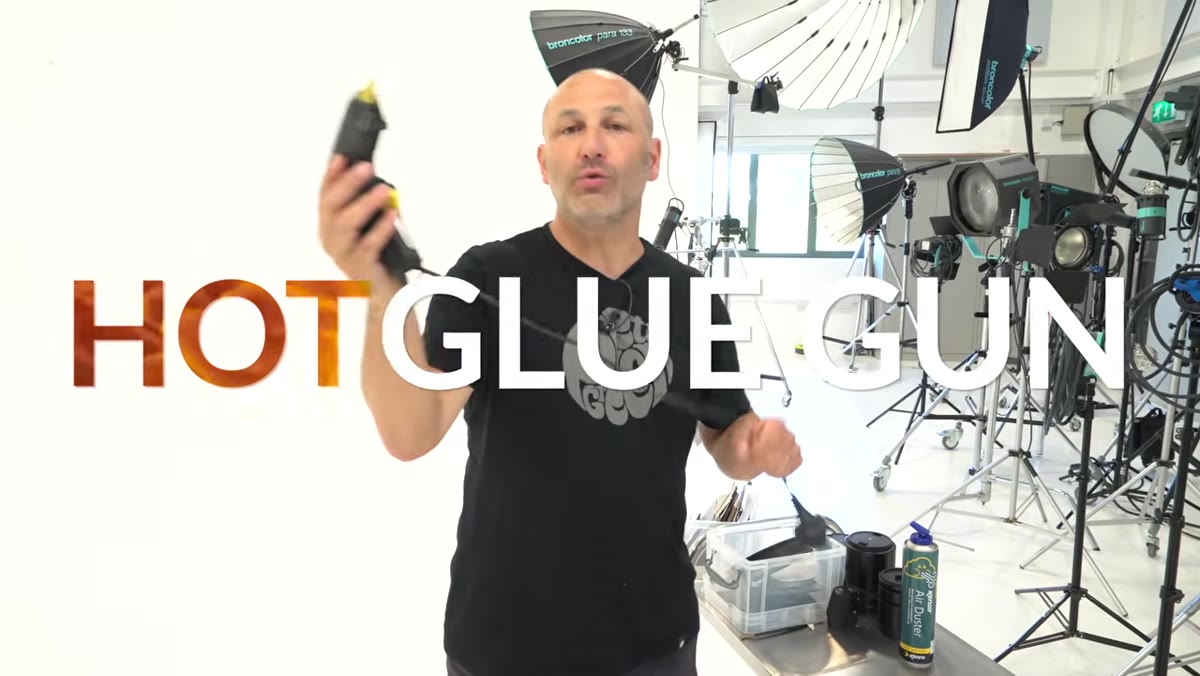 Hot glue gun used to attach products to acrylic rods