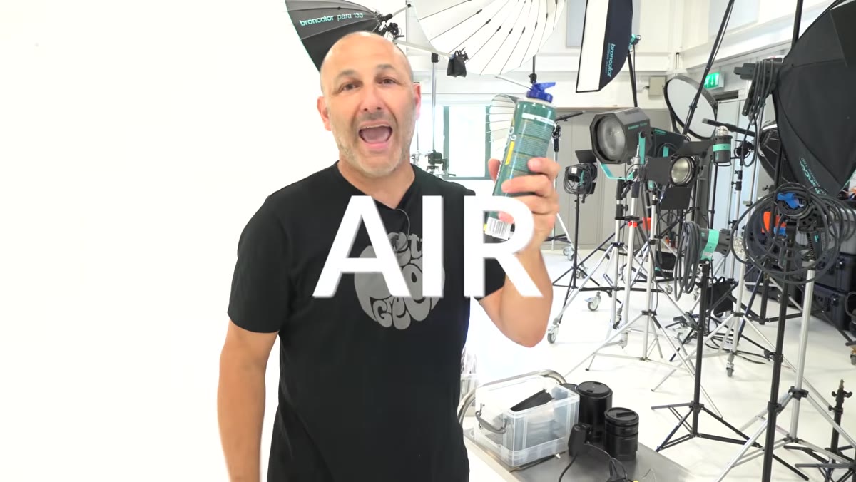 Compressed air canister for pre-shoot product cleaning