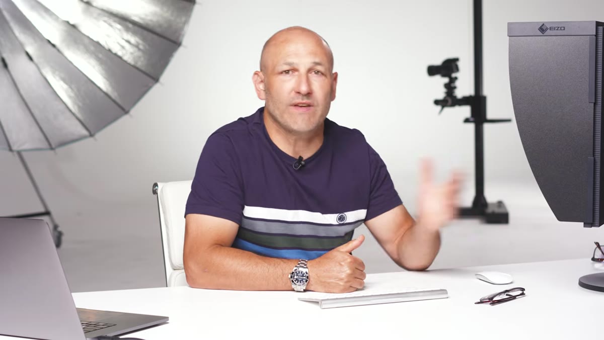 Instructor positioning a light to the side of a subject