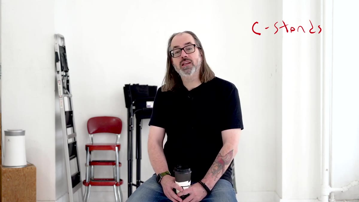 C-stand with arm extended in studio environment