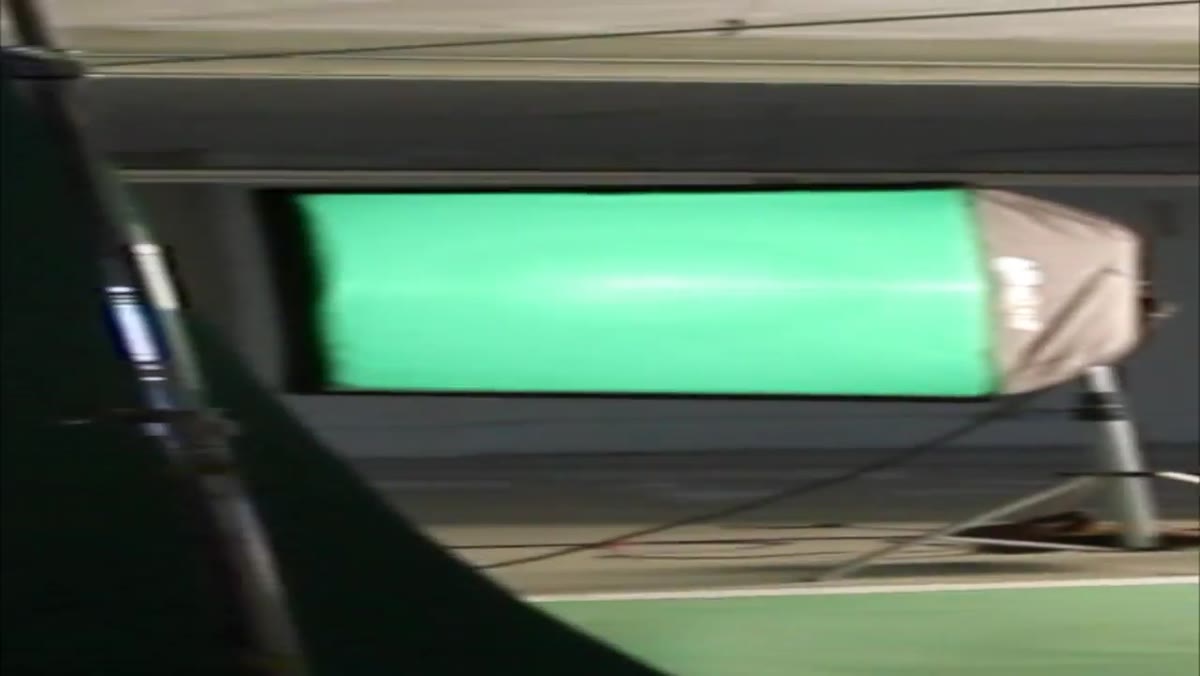 Two large softboxes with green gels lighting the backdrop