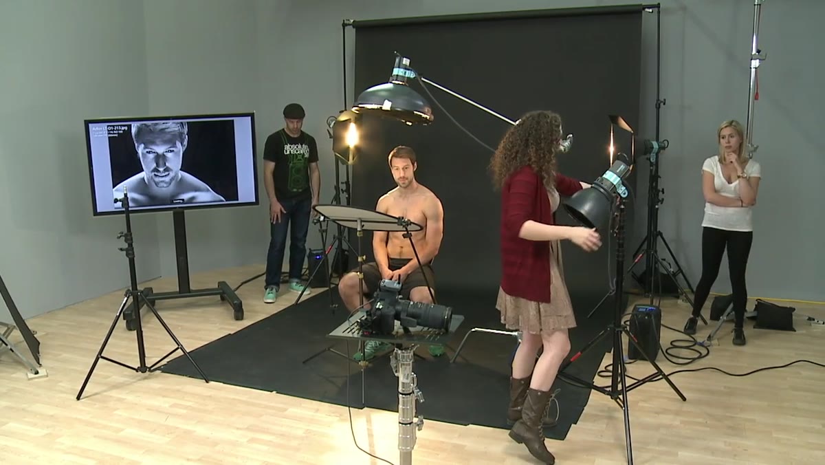 Low light source aimed upward at male subject&rsquo;s face