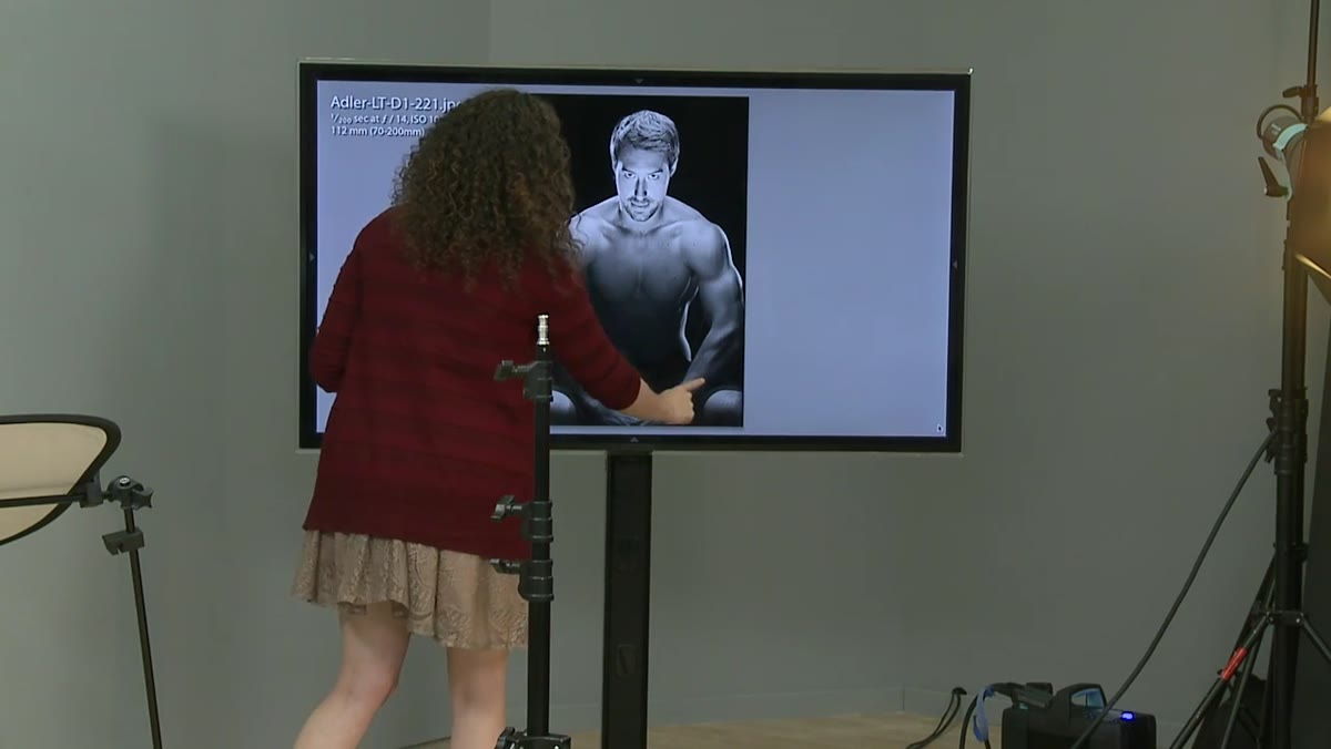 Rim lights visible on subject&rsquo;s sides, defining arm and shoulder edges