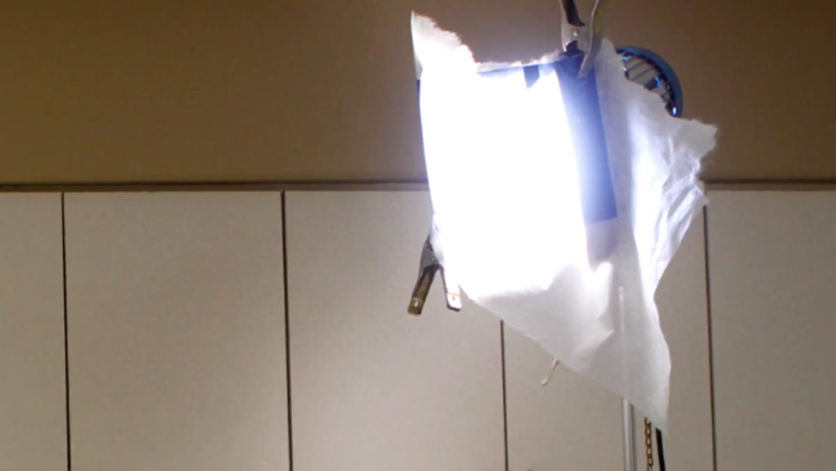 1K light with blue gel positioned as key light in morgue