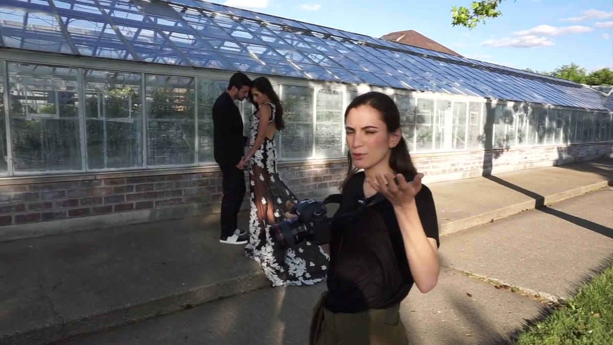 Photographer moving to different angles while subjects hold position