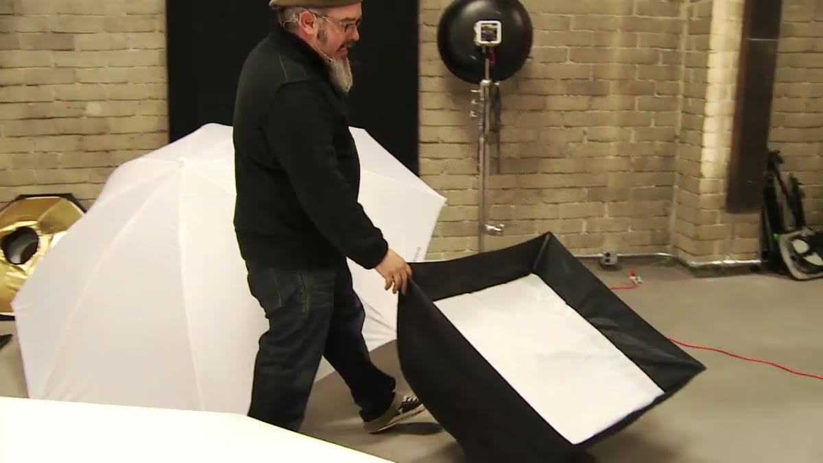 The Westcott Apollo 28-inch softbox opening like an umbrella on a stand