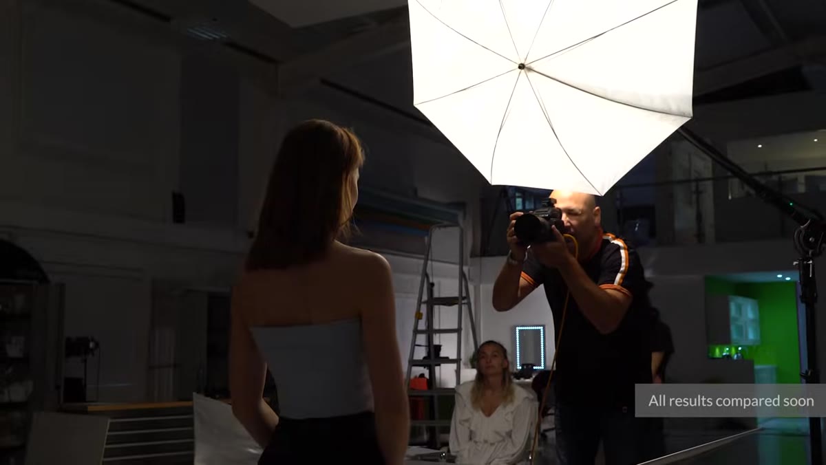 70cm white shoot-through umbrella positioned on stand