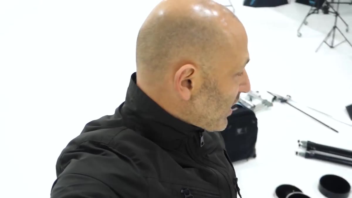 Photographer checking tripod and camera body against a mental checklist