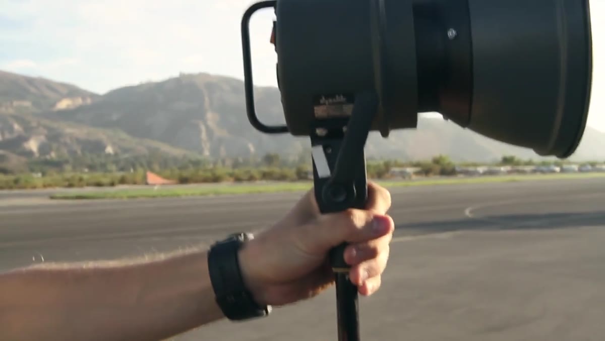 Bare strobe head aimed at the front of the biplane