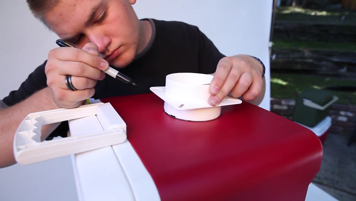 Tracing the dryer vent circle on the cooler end with a marker
