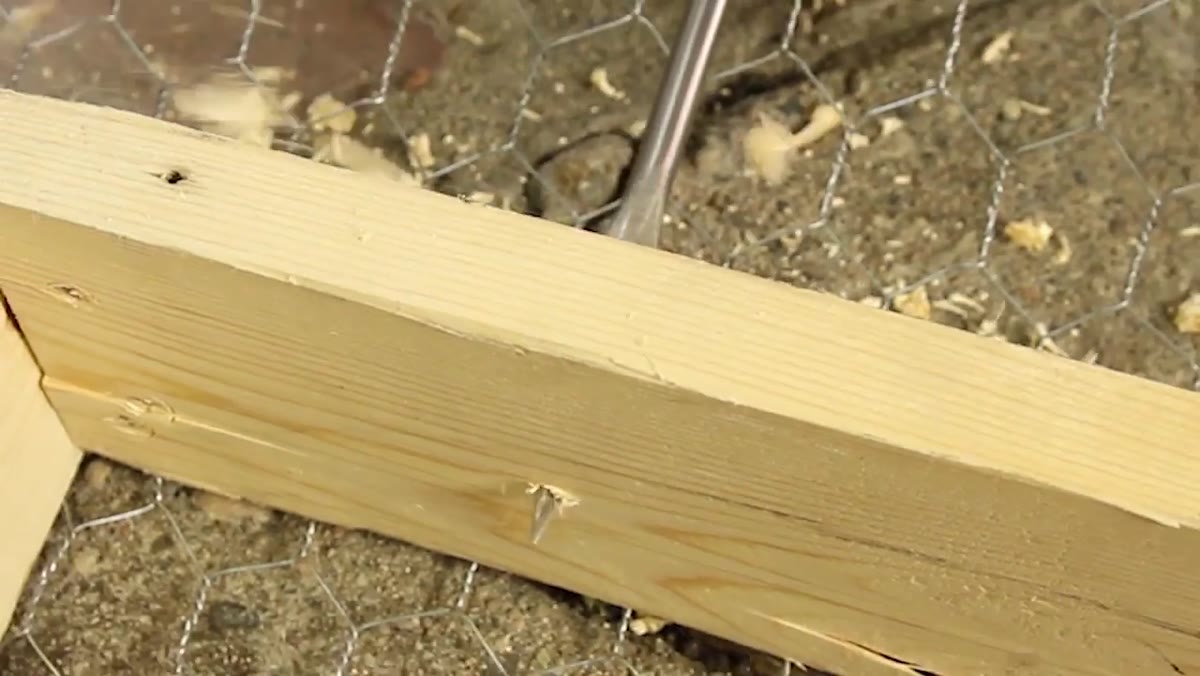 Drilling rope holes in each end of the frame for hanging