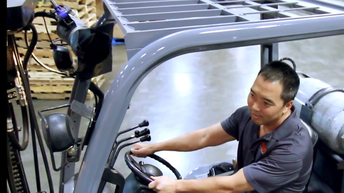 Strobe head clamped to forklift beside the driver