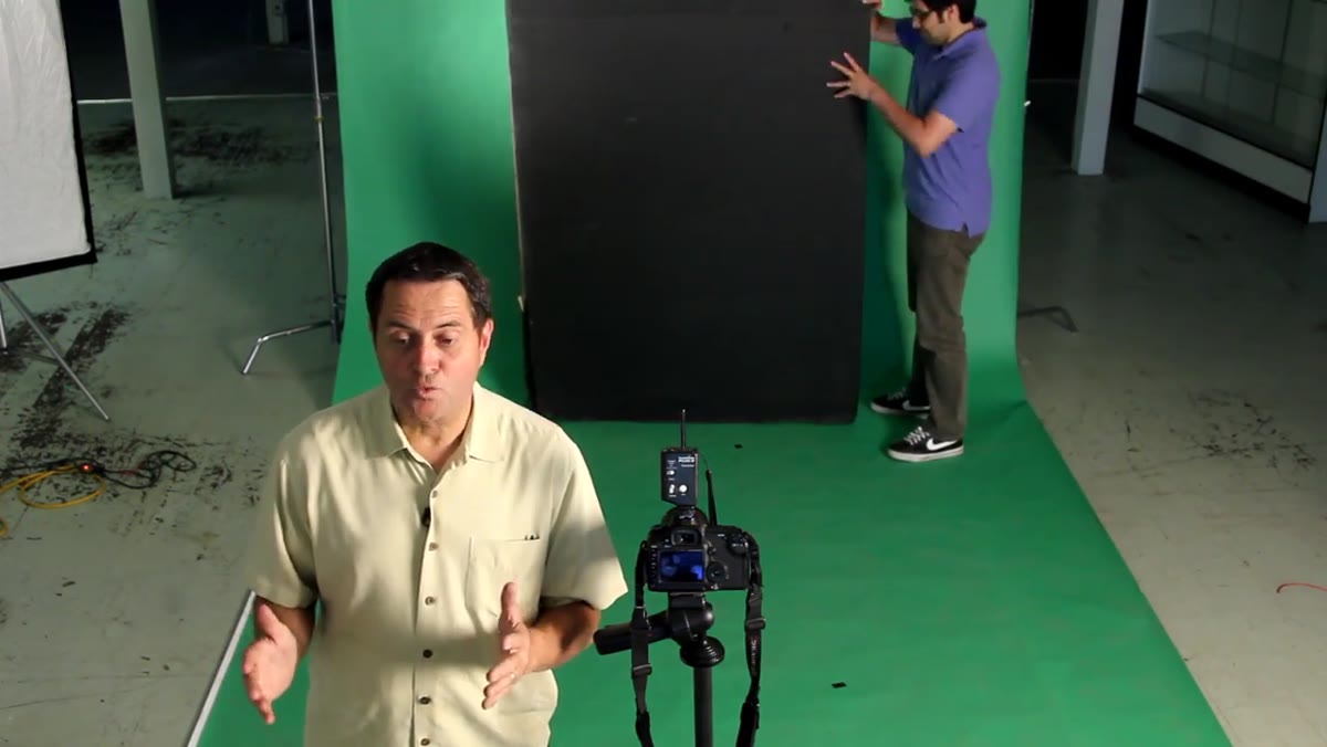 Black background positioned behind suspended bottle rig