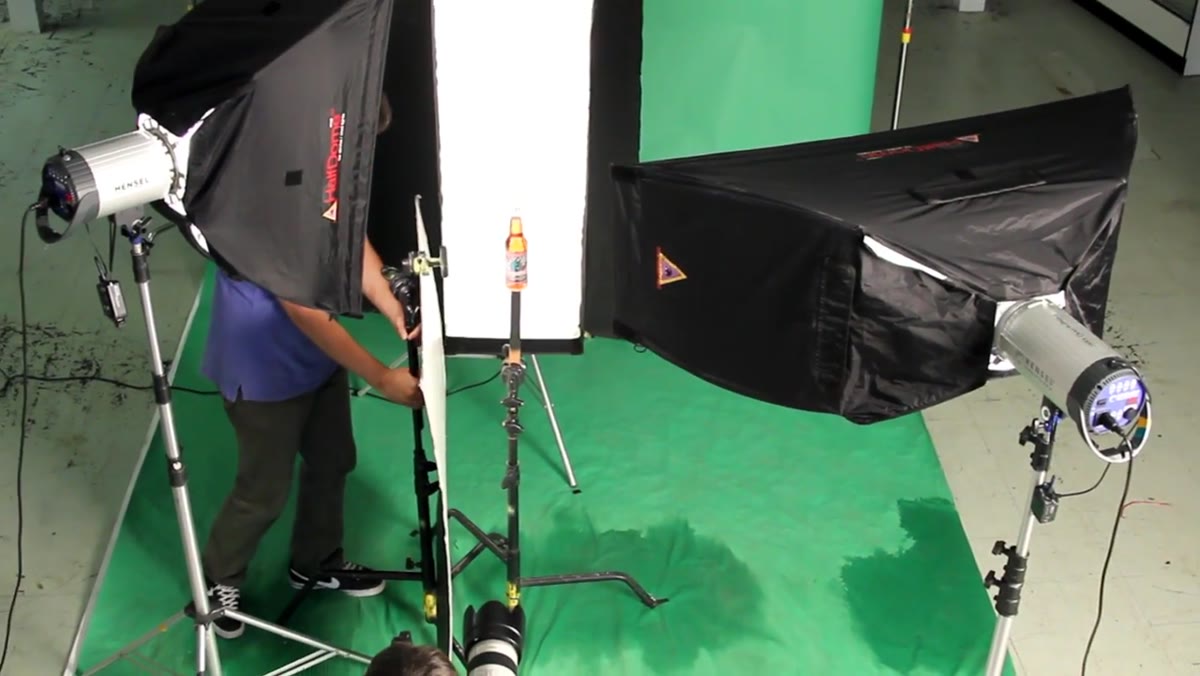 Large white fill card positioned on camera left beside bottle