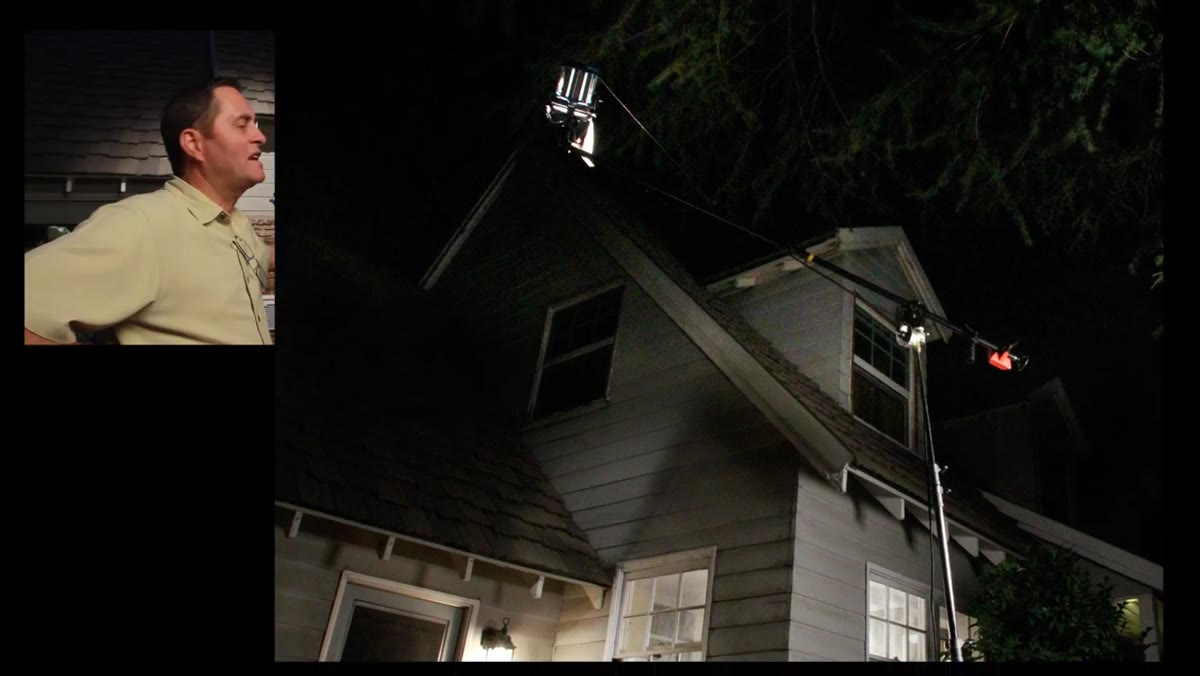 Overhead 1K light positioned above window exterior