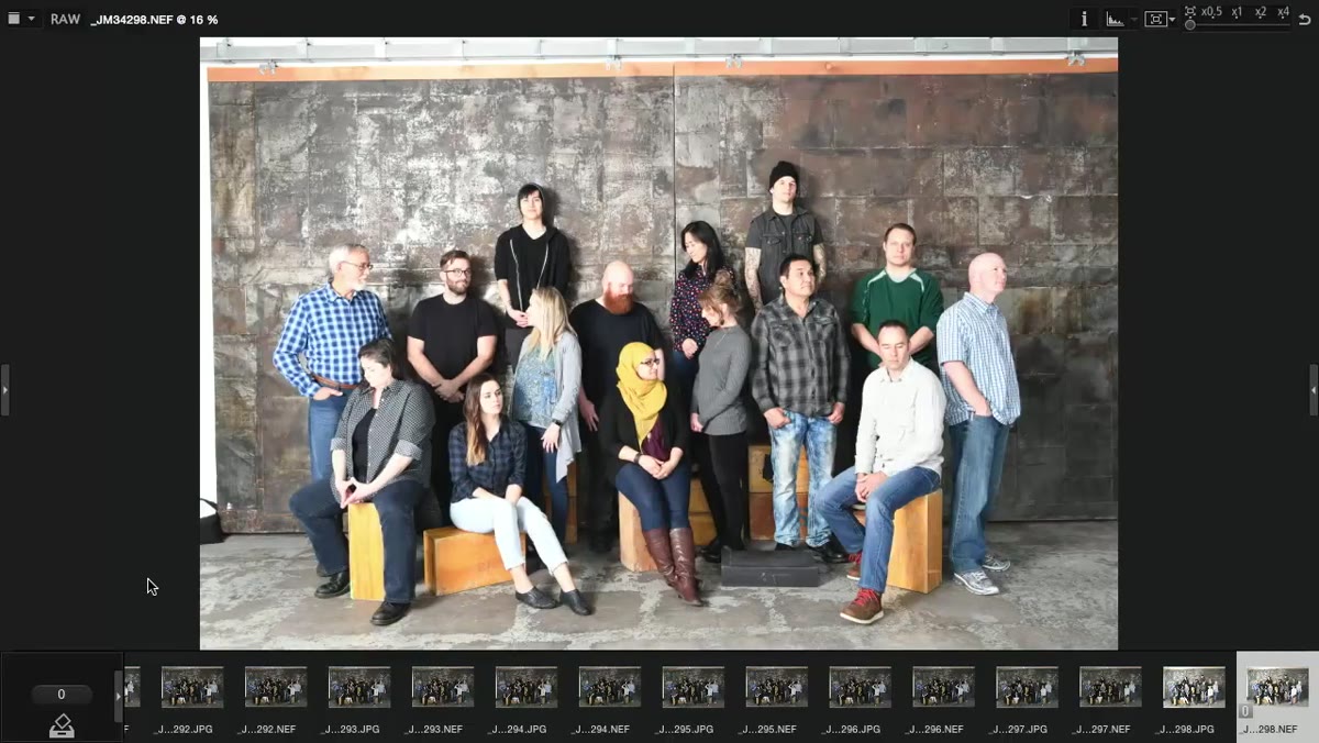 Photographer reviewing test shot and reducing flash power