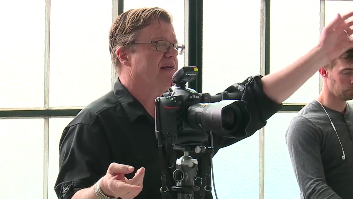 Photographer pulling ambient exposure down by one stop