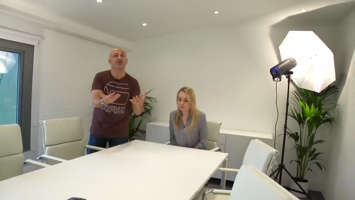 White table surface visible in front of seated subject