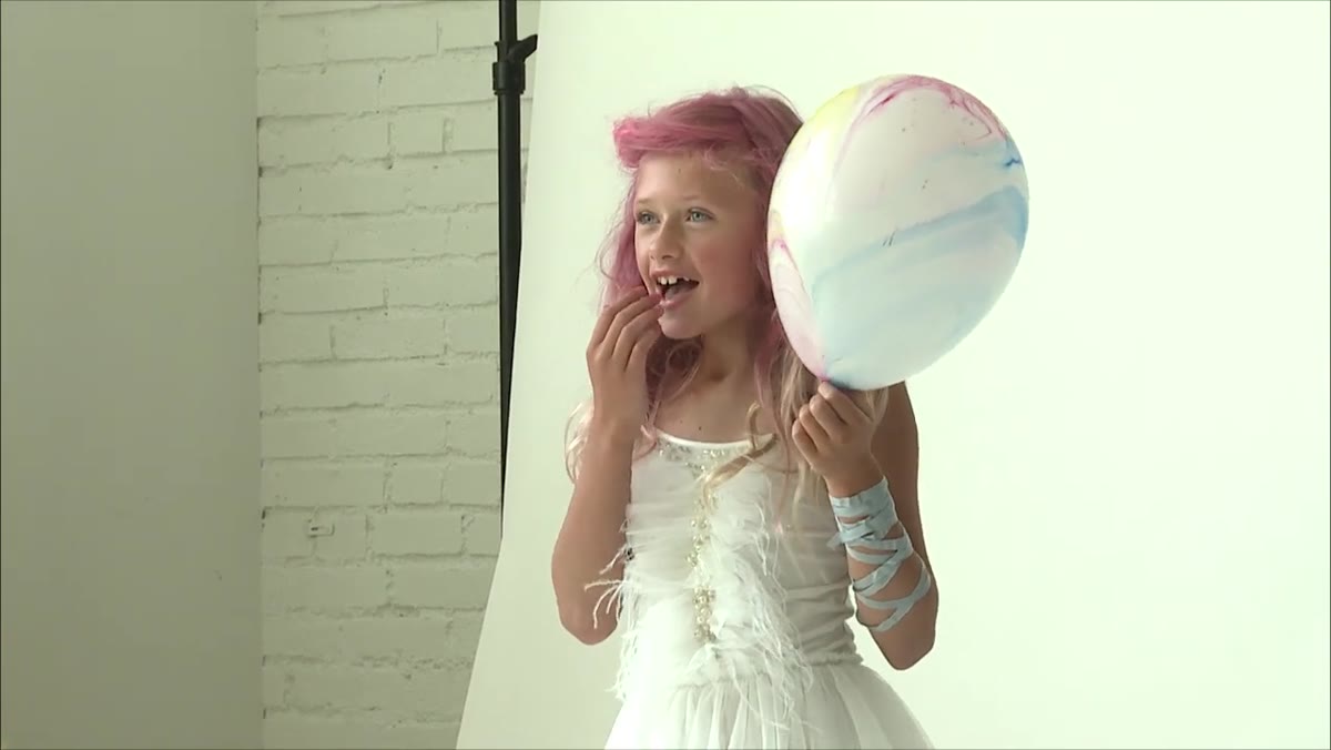 Photographer describing a surprise party scenario to prompt genuine reaction