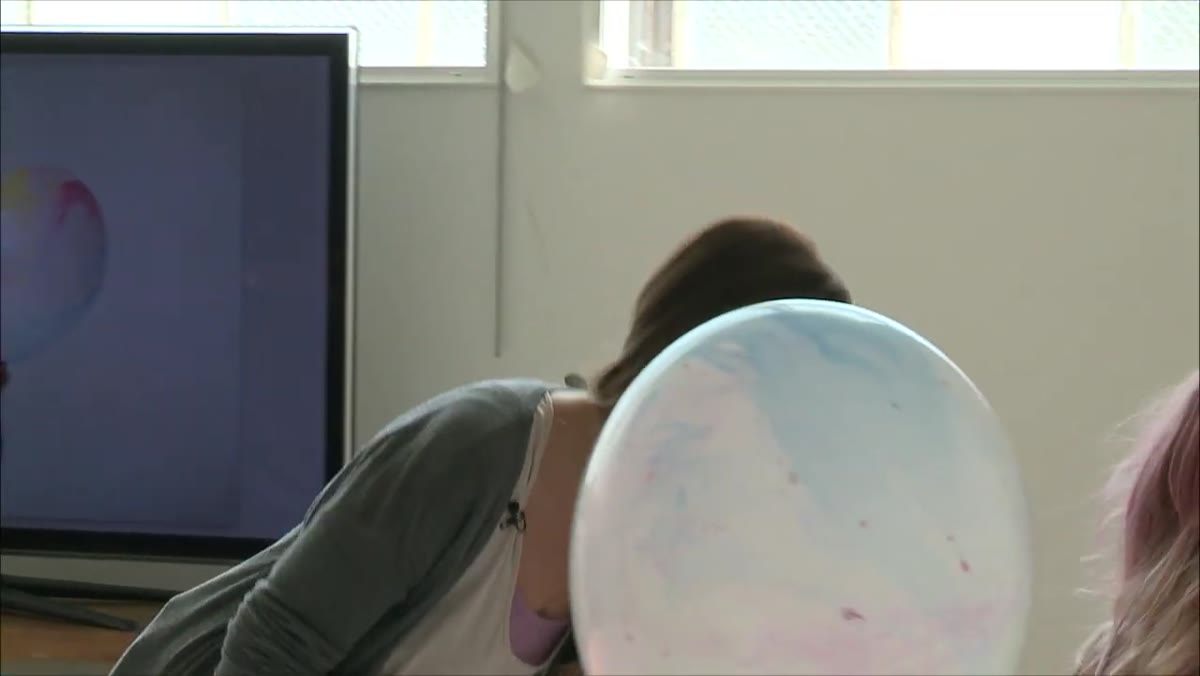 Photographer selecting a second balloon with better color coordination