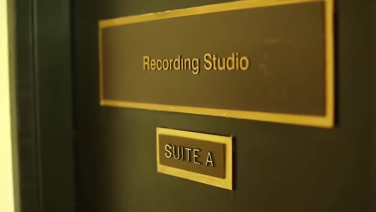 Band discovering a larger available studio down the hallway