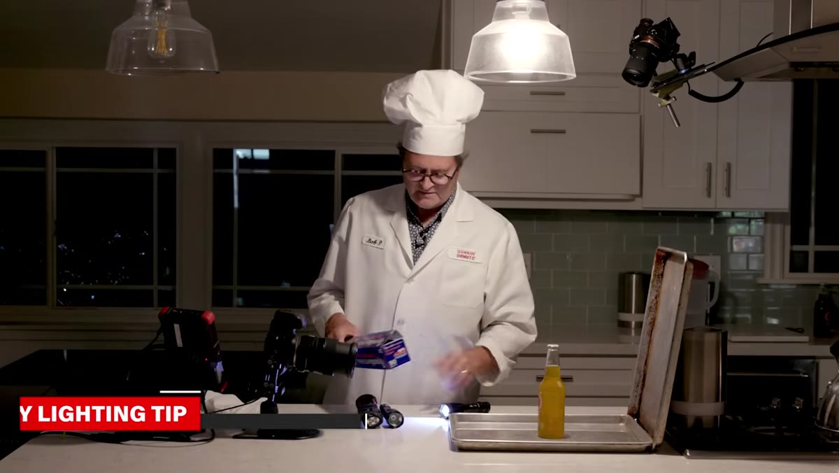 Parchment paper being wrapped around flashlight to reduce intensity
