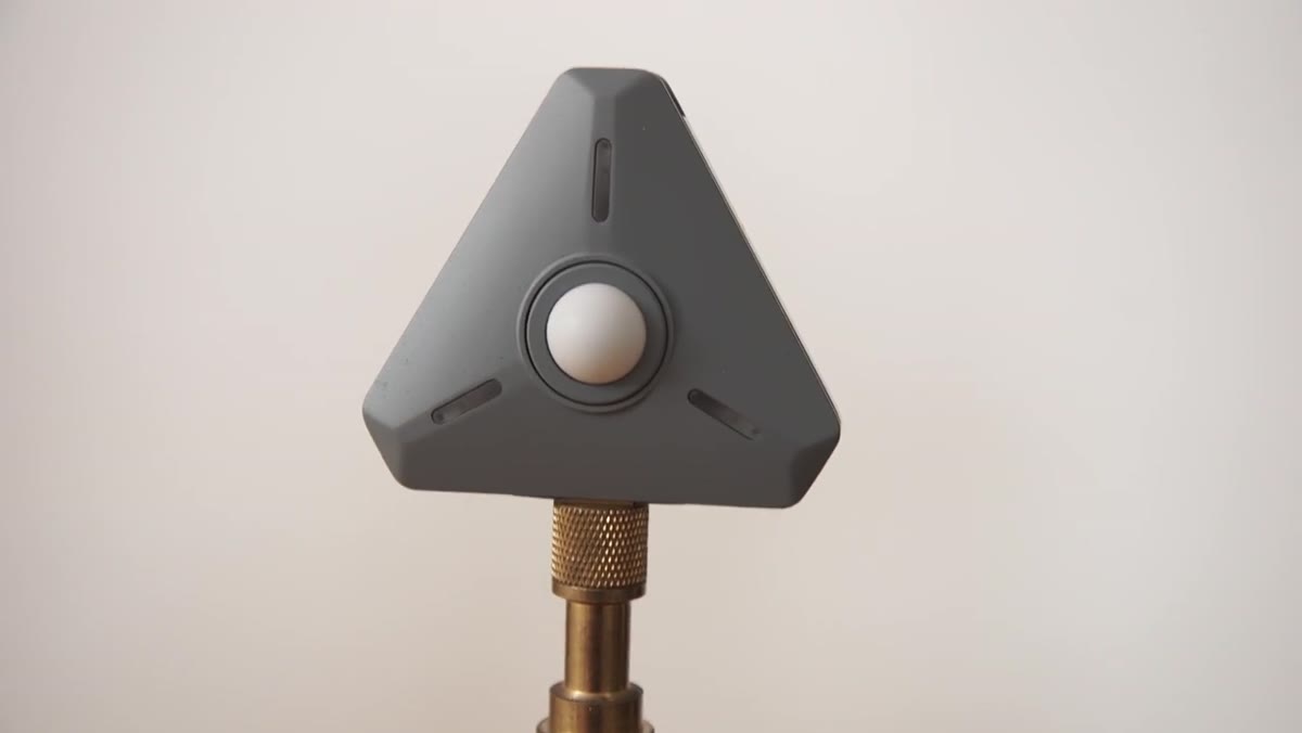 Light meter positioned close to subject on key light side