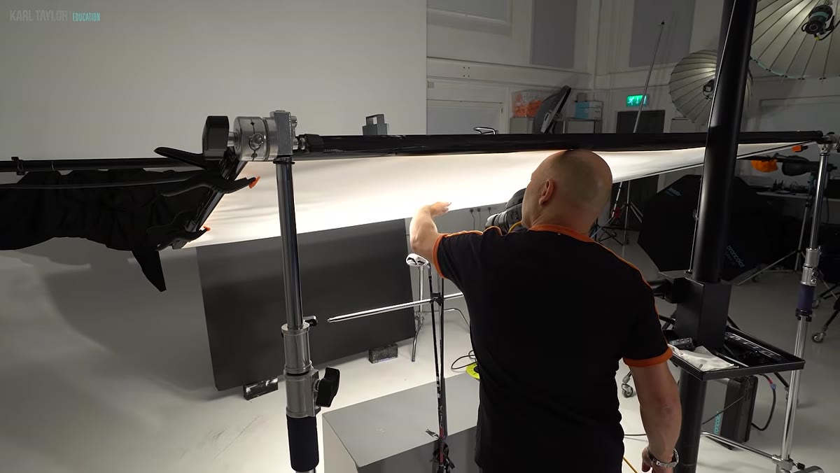 Scrim being raised to eliminate lens flare entering the camera
