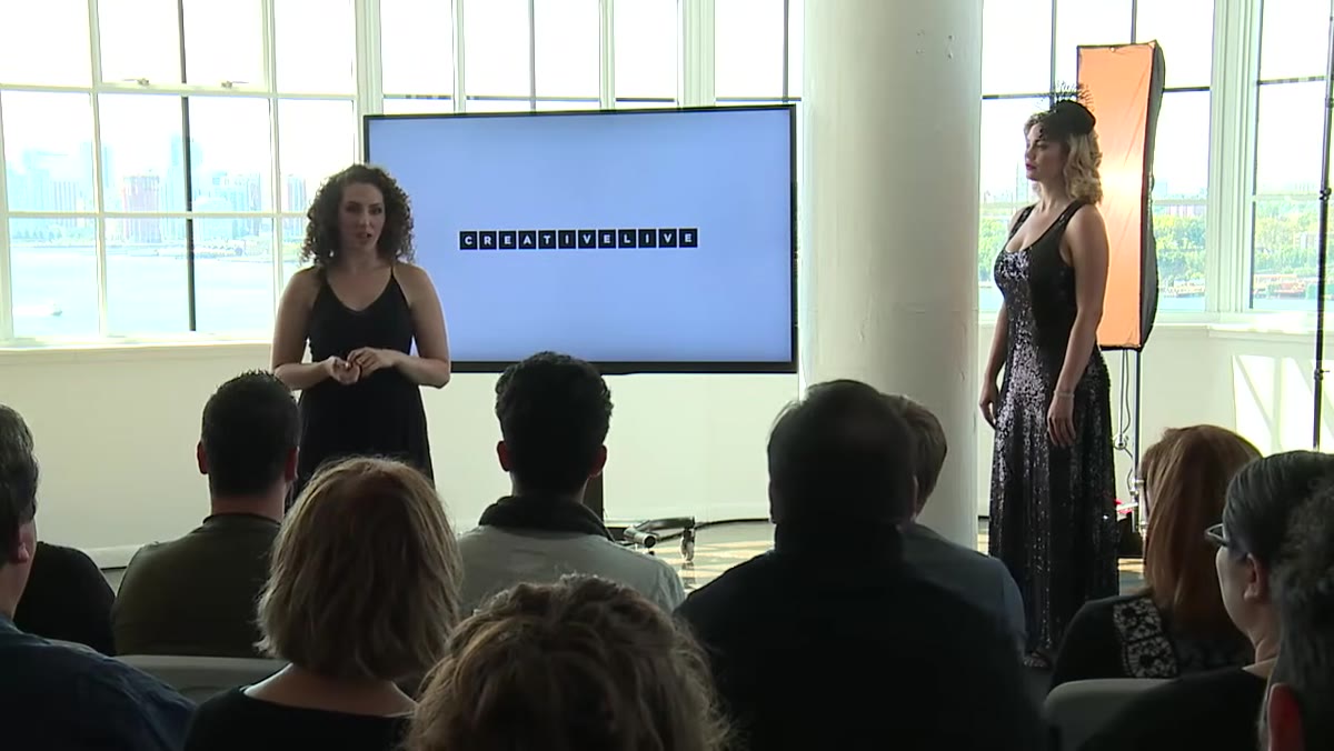 Instructor discussing ambient light interference in a bright studio
