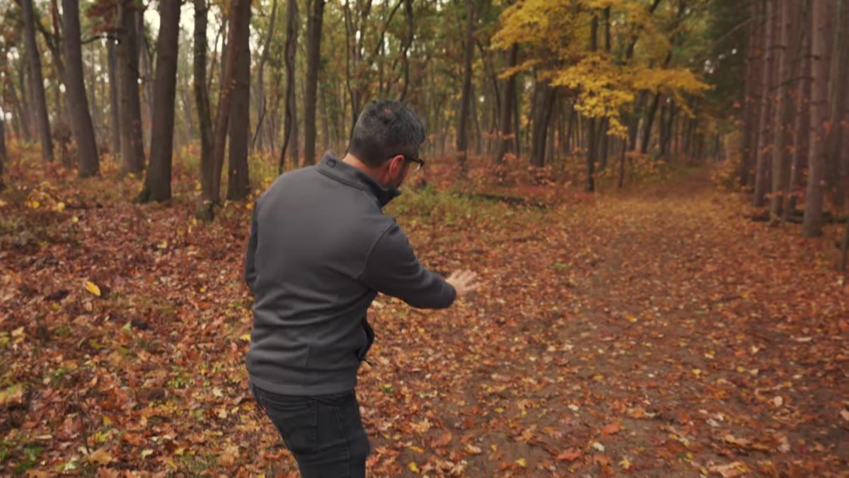 Eli directing the subject away from mud toward fallen yellow leaves