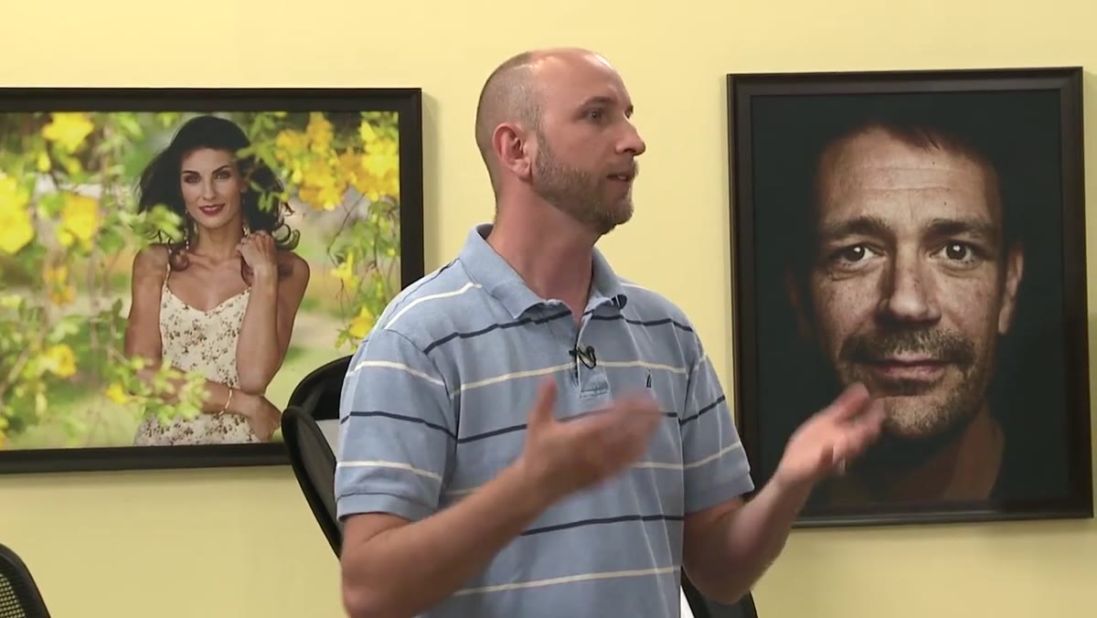 Instructor explains channel separation for two photographers shooting same event