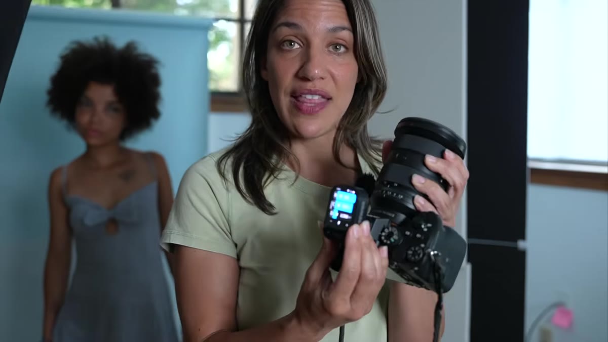 Chelsea attaching QZ trigger to camera hot shoe