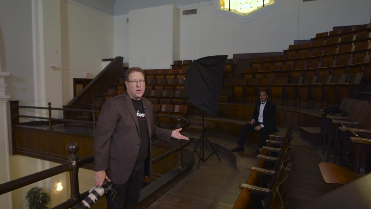 Softbox positioned at 45-degree angle to seated subject