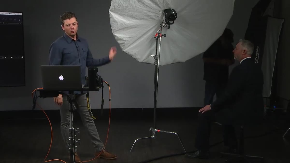 Instructor gesturing to demonstrate the 35-degree downward light angle