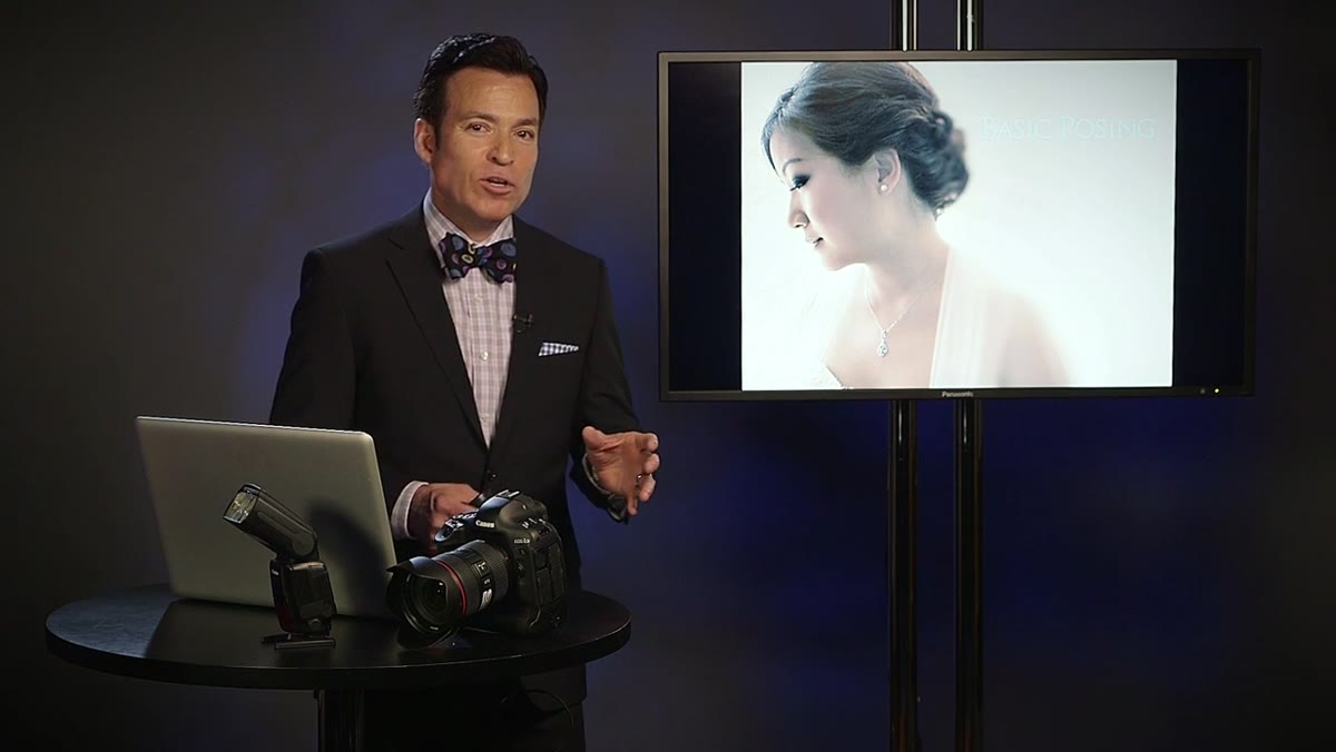 Presenter pointing to image showing couple&rsquo;s relaxed facial expressions