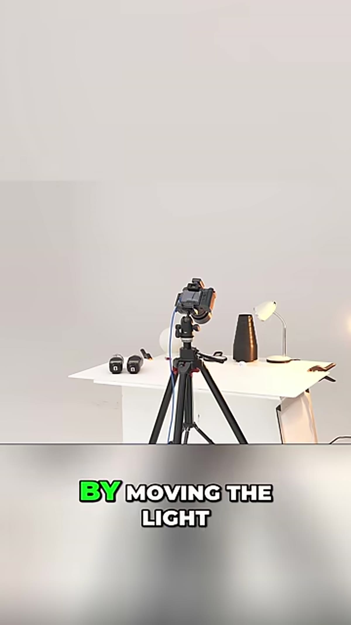 Instructor lowers light, demonstrating how the shadow grows longer