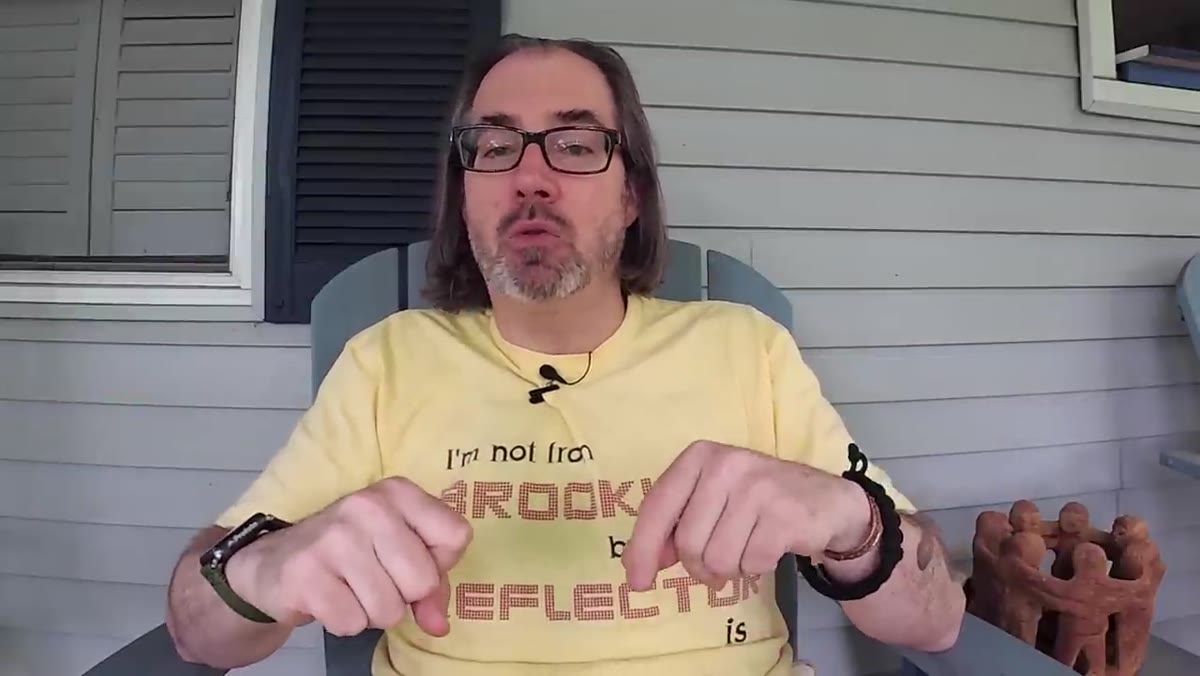 Presenter discussing effect of larger light source on reflections