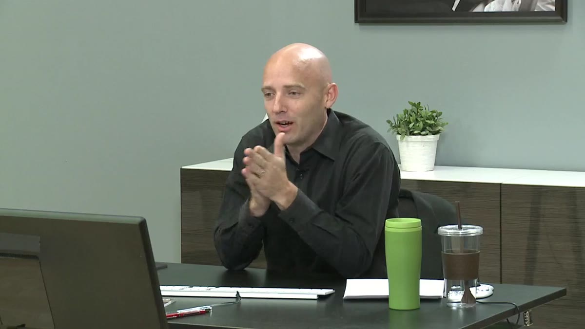 Platt gesturing while explaining post-production efficiency to the studio audience