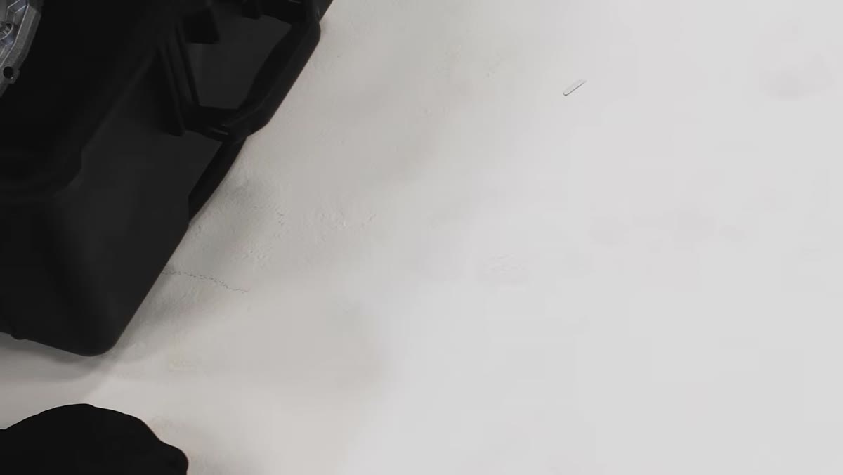 Close-up of scuff marks and footprints on the white cyc floor