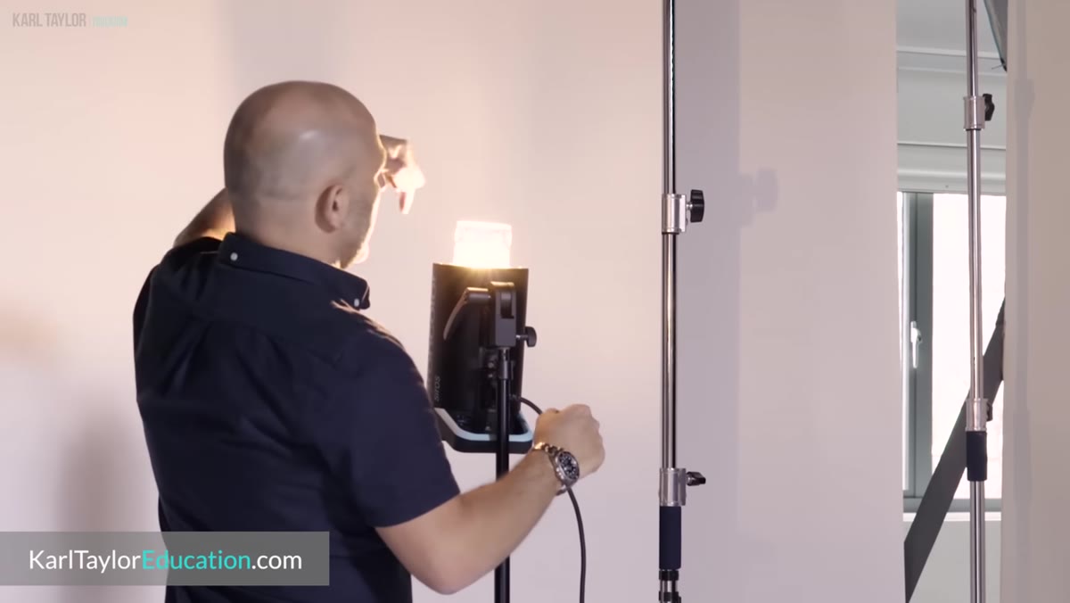 Dark-painted studio walls contrasted with white-walled space