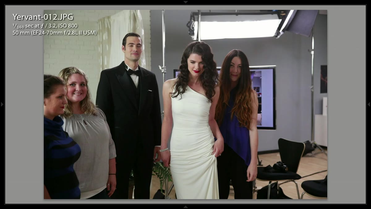 Bride stepping forward while the rest of the group stays back