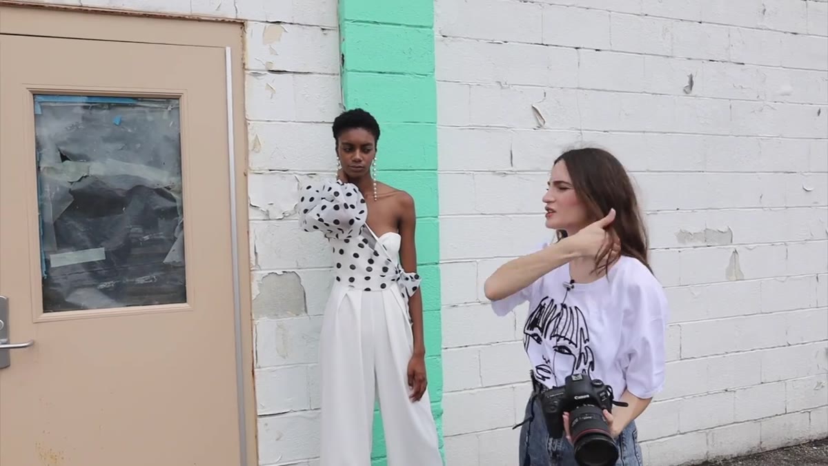 Model&rsquo;s hand pressed flat against neck, elbow jutting outward awkwardly