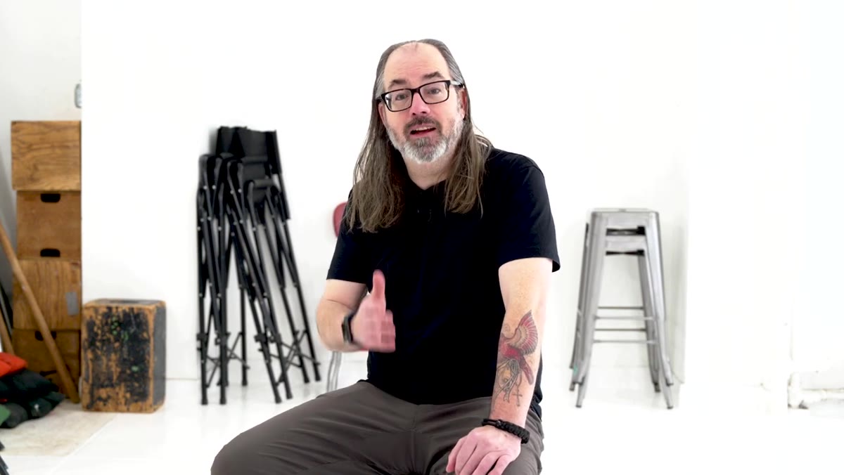 Daniel pointing to shadow direction on a portrait