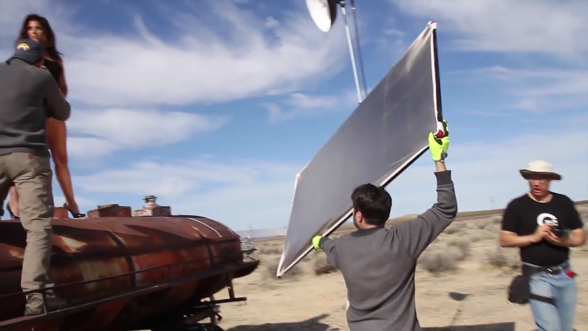 Reflector positioned facing subject in outdoor desert location