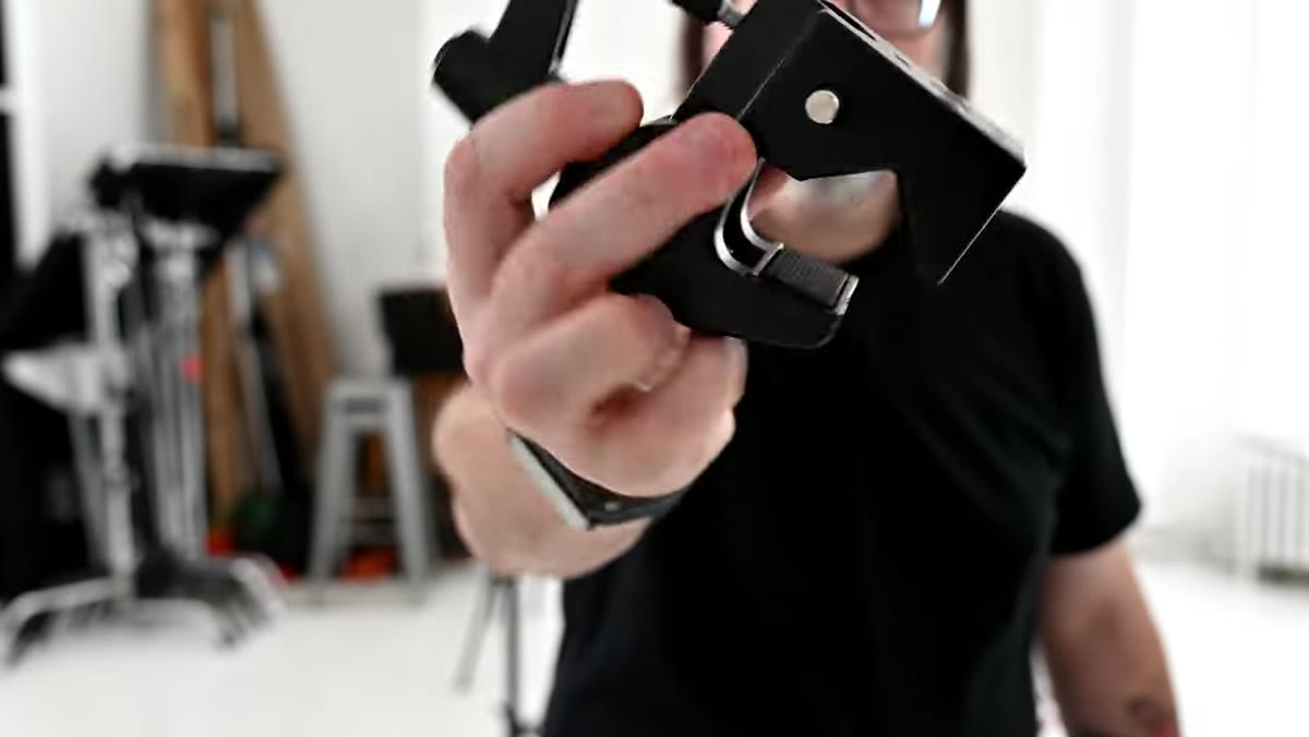 Super clamp holding a camera arm on a studio pipe