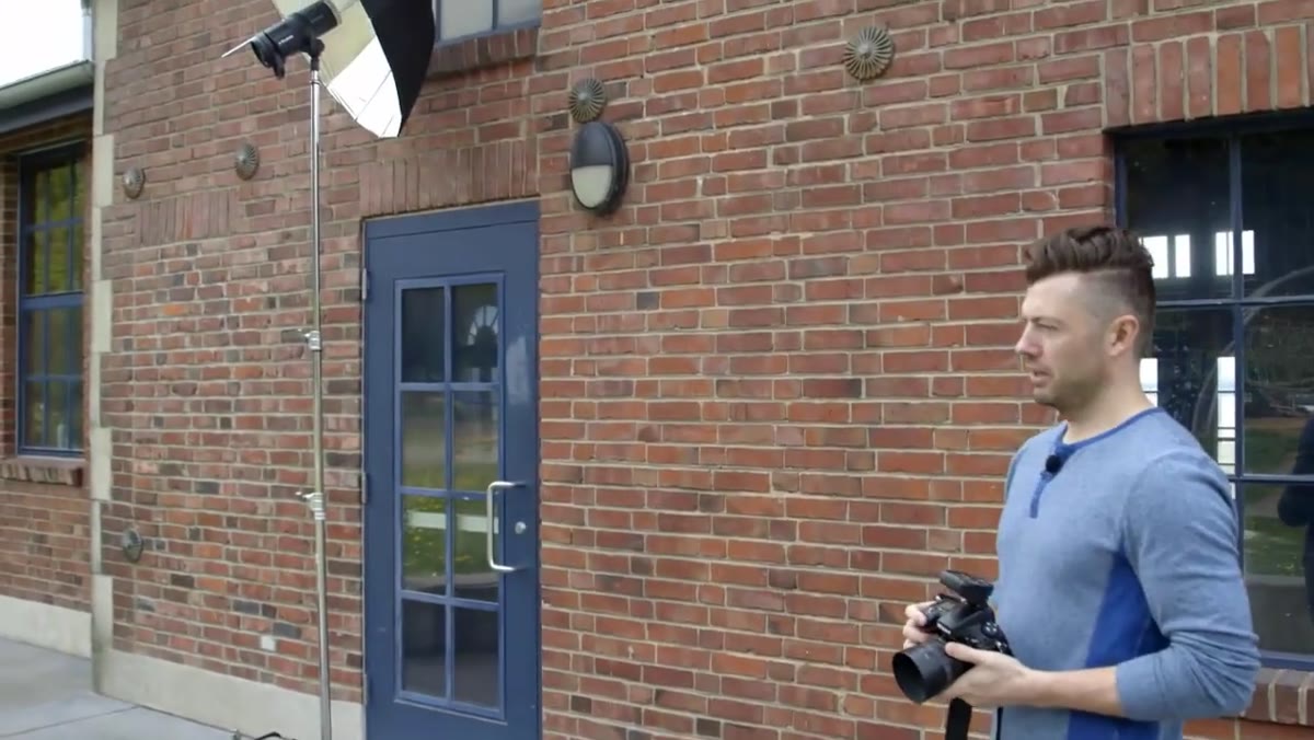 Silver Profoto umbrella set up outdoors for Noah&rsquo;s shoot