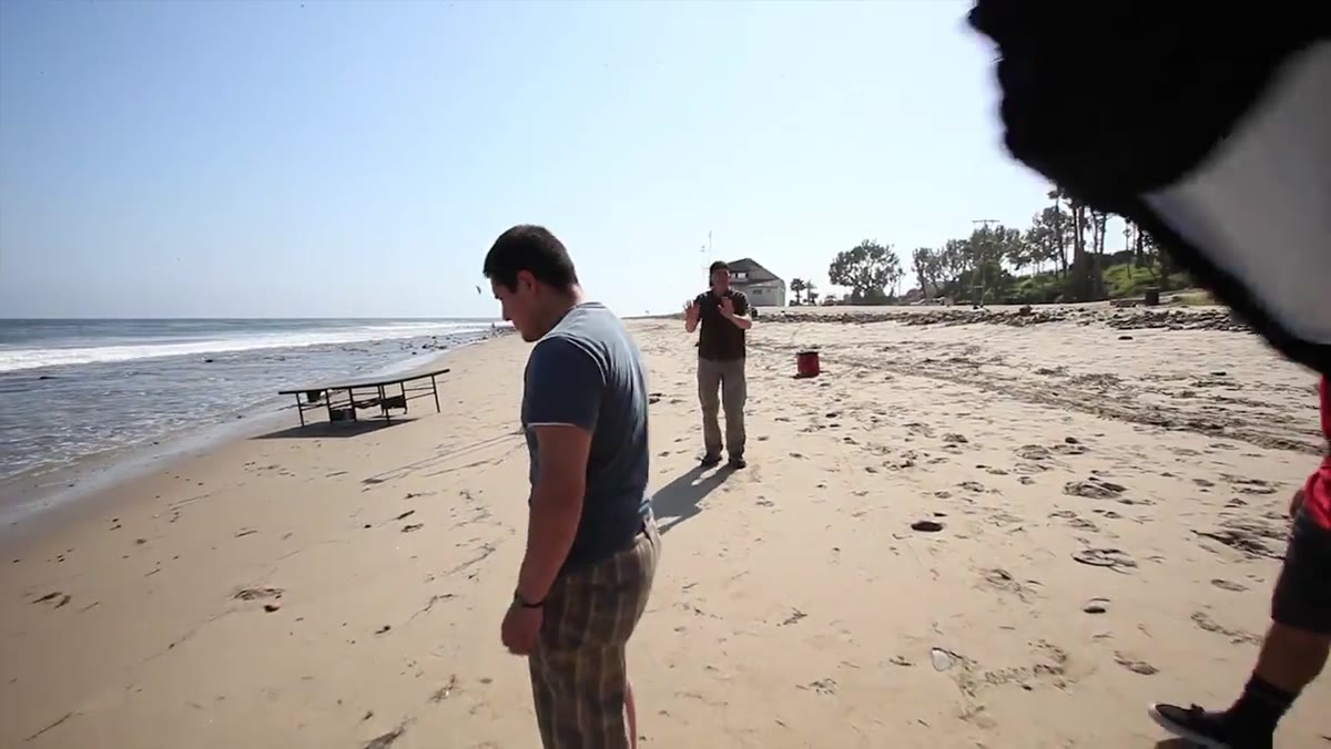 Photographer assessing beach location and sun position