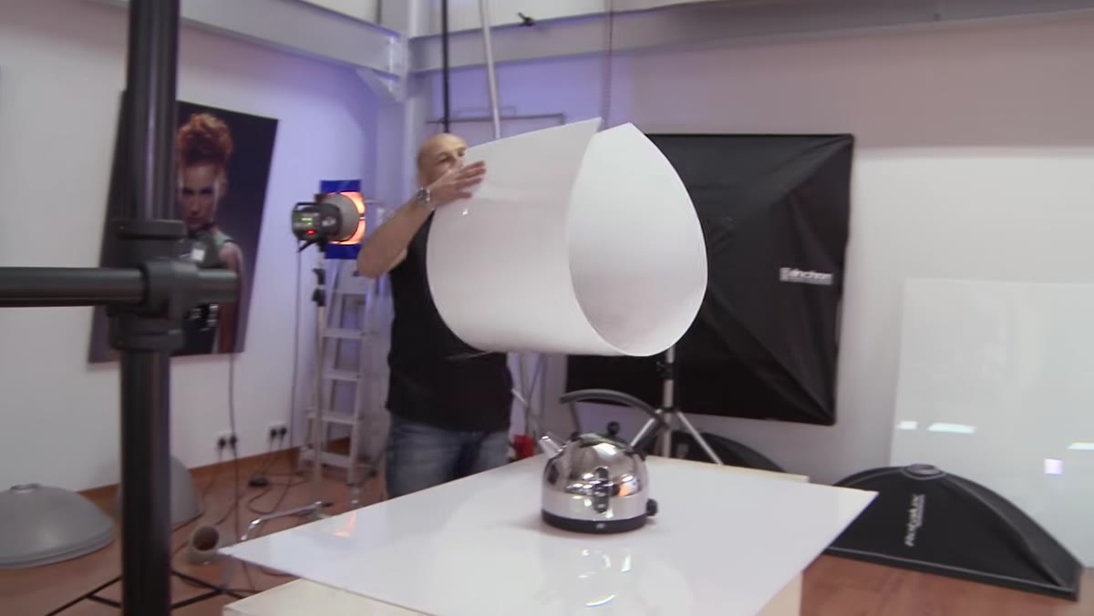 Curved plexiglass sheet shaped around the kettle