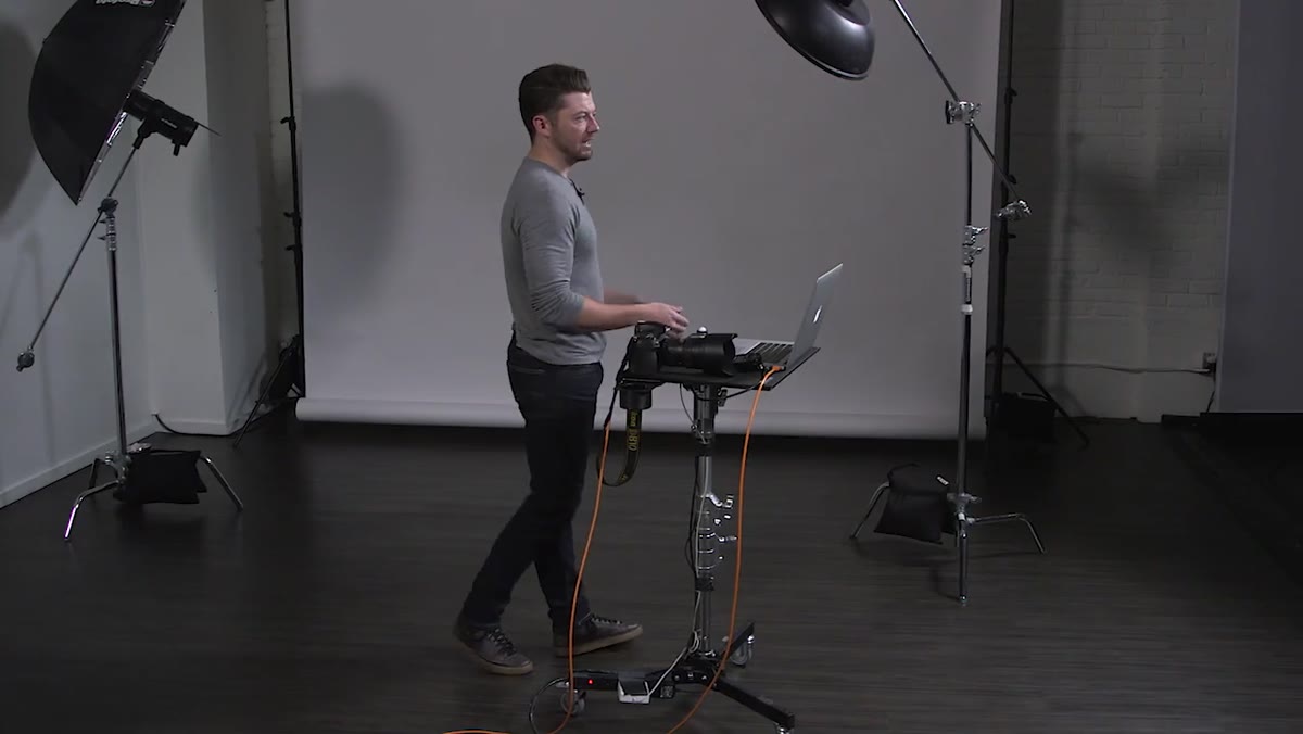 Studio setup showing model on white seamless backdrop