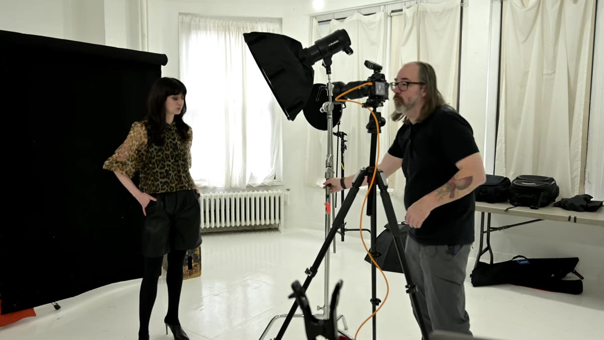 Photographer&rsquo;s fingers at the edge of the camera frame as a positioning guide